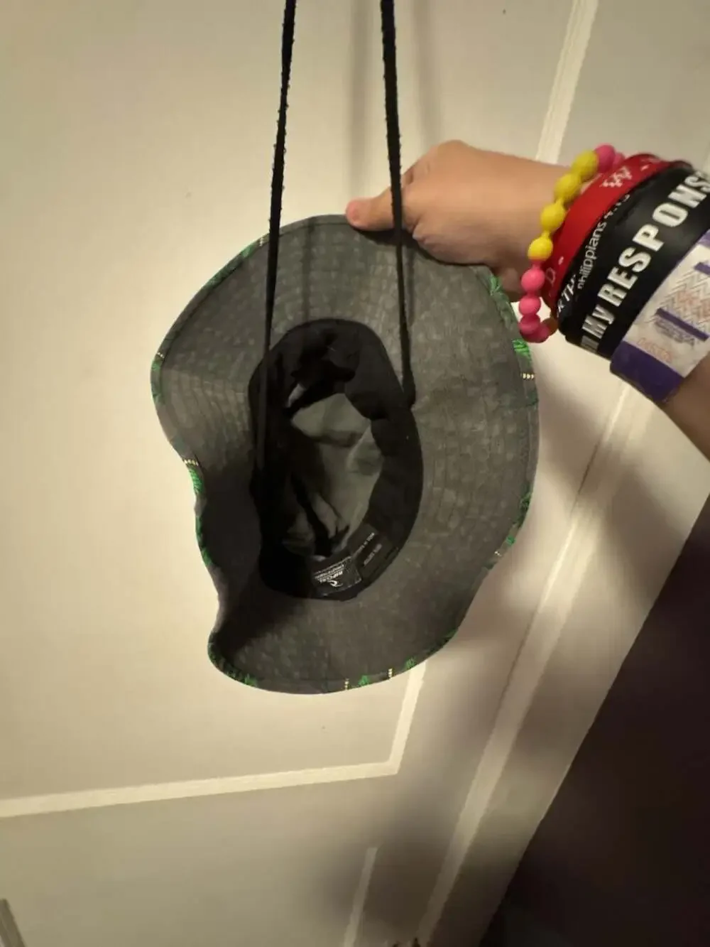 Rip Curl grey bucket hat with green palm tree print